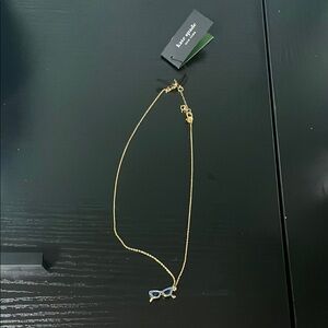 Kate Spade gold necklace with sunglasses charm